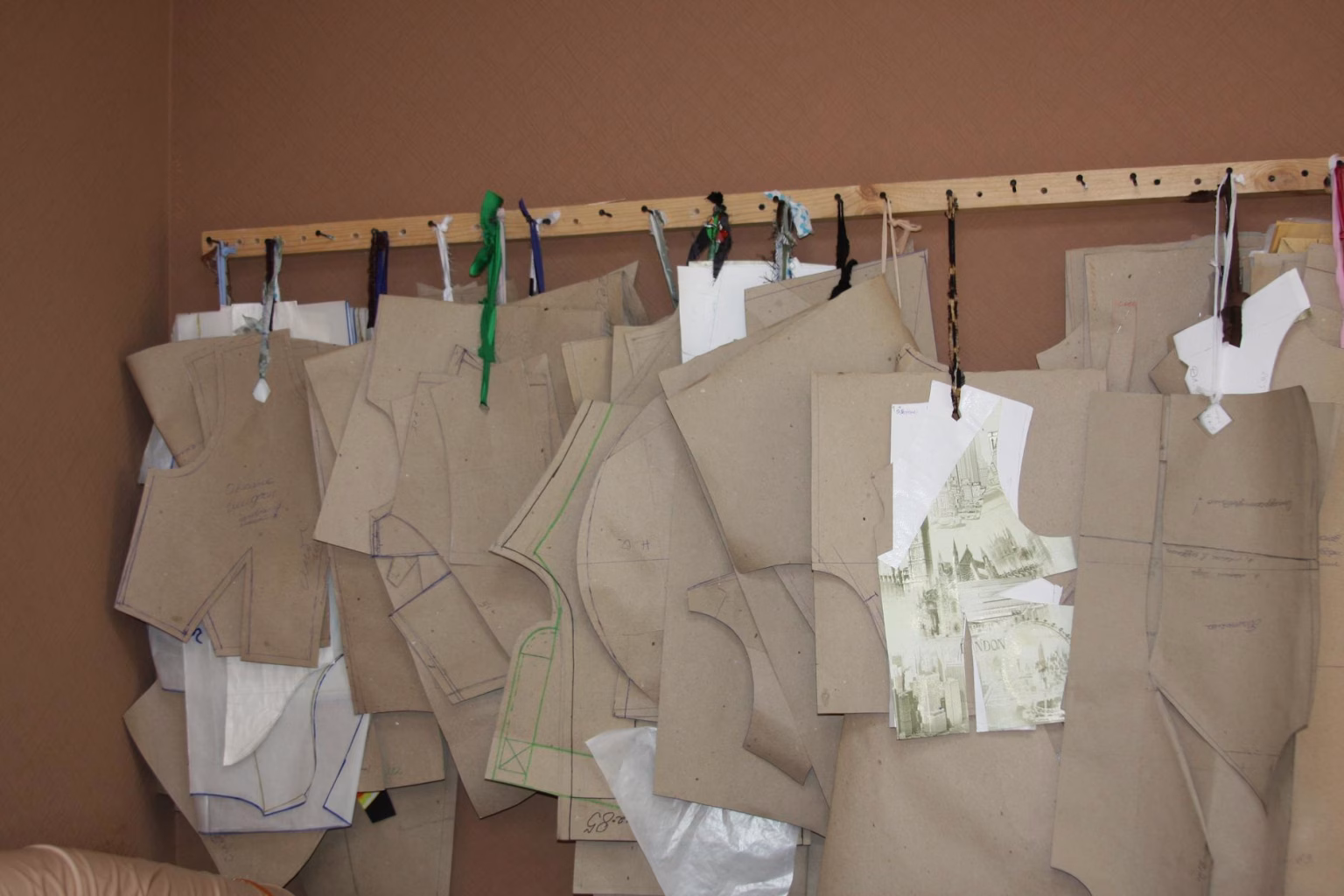 sewing patterns hanging on wall