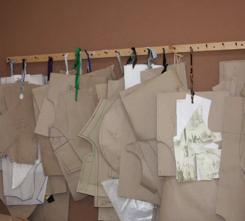 sewing patterns hanging on wall