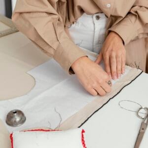 fashion designer working her workshop alone